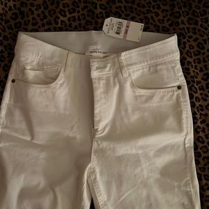 A pair of brand new white high rise womens pants with tags still on